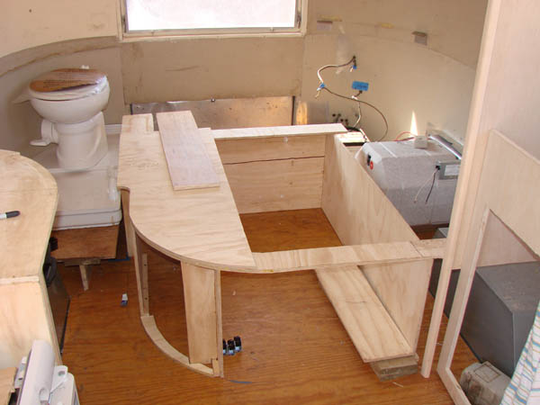 Cabinet frames installed in the bed area.